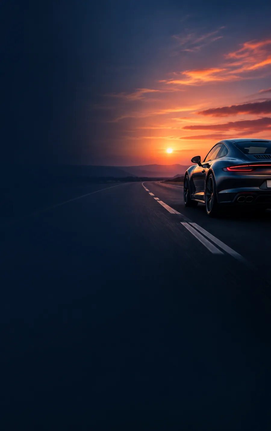 Sports car driving into the sunset